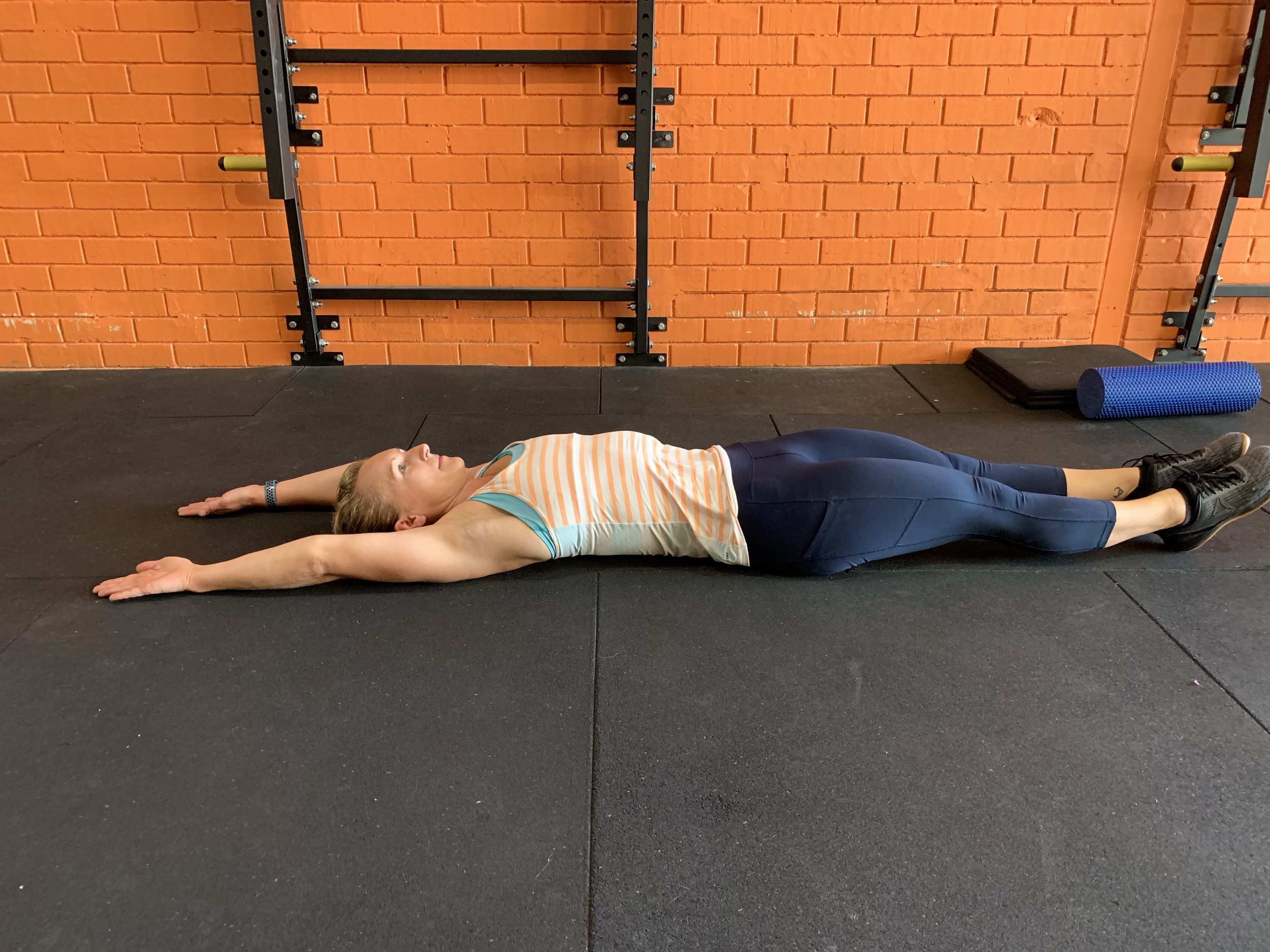 Straighten your legs. If your wrists can now touch the floor, then you probably have tight lats.