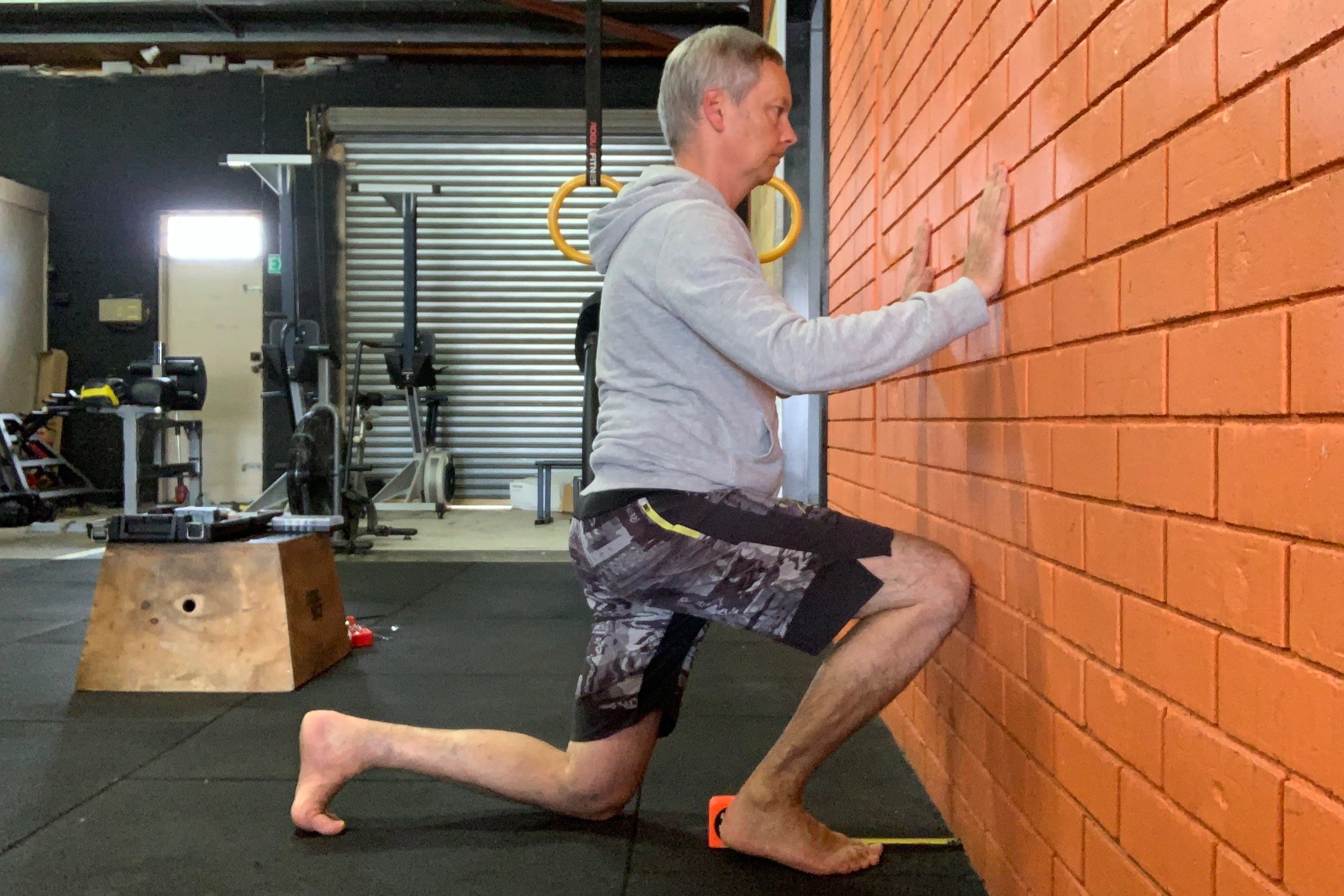 FAIL: When you take your knee to the wall, your heel comes off the ground, your knee falls in, or it hurts