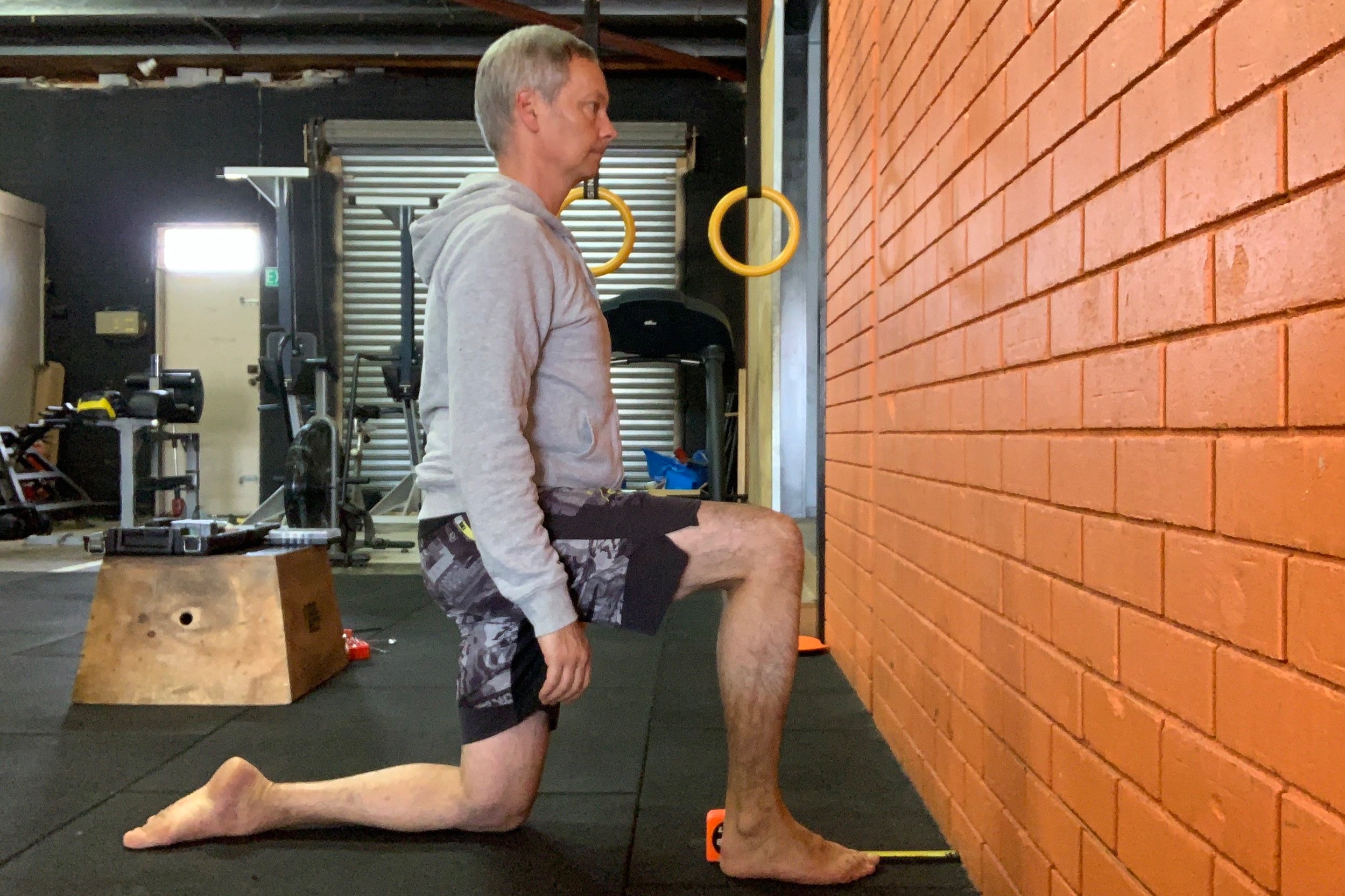 Kneel facing the wall