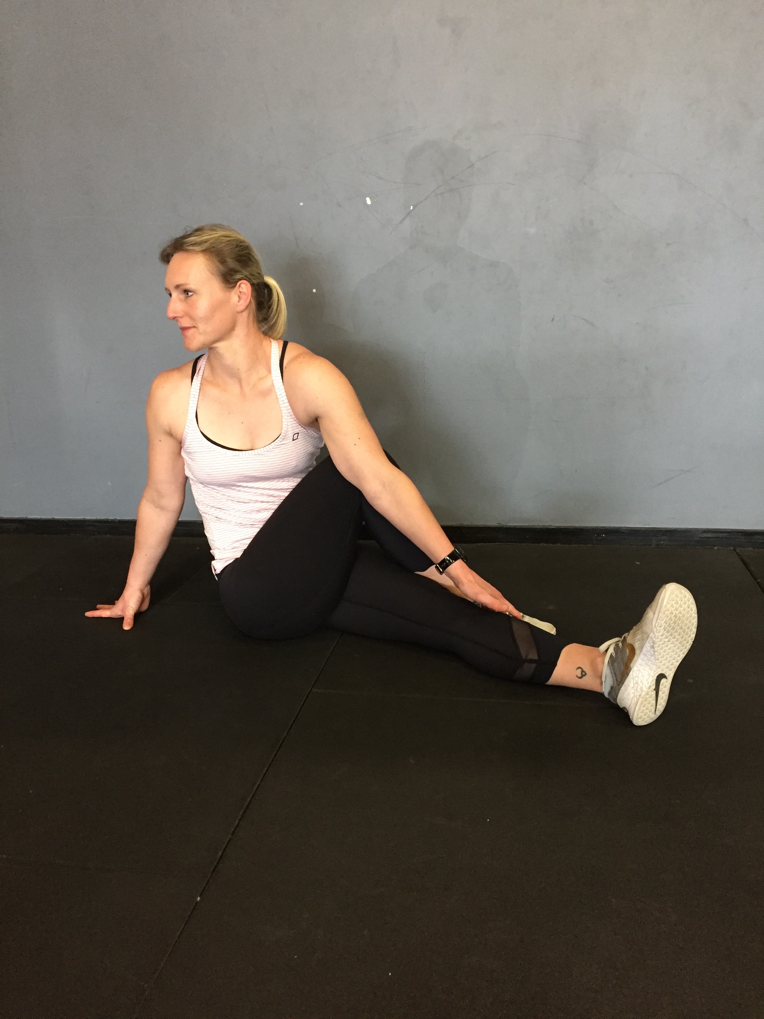 seated T-spine rotation with bottom leg straight